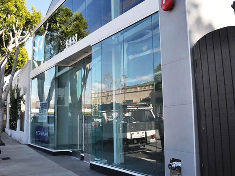 Full-height storefront glazing filmed end to end without changing how the frontage reads.